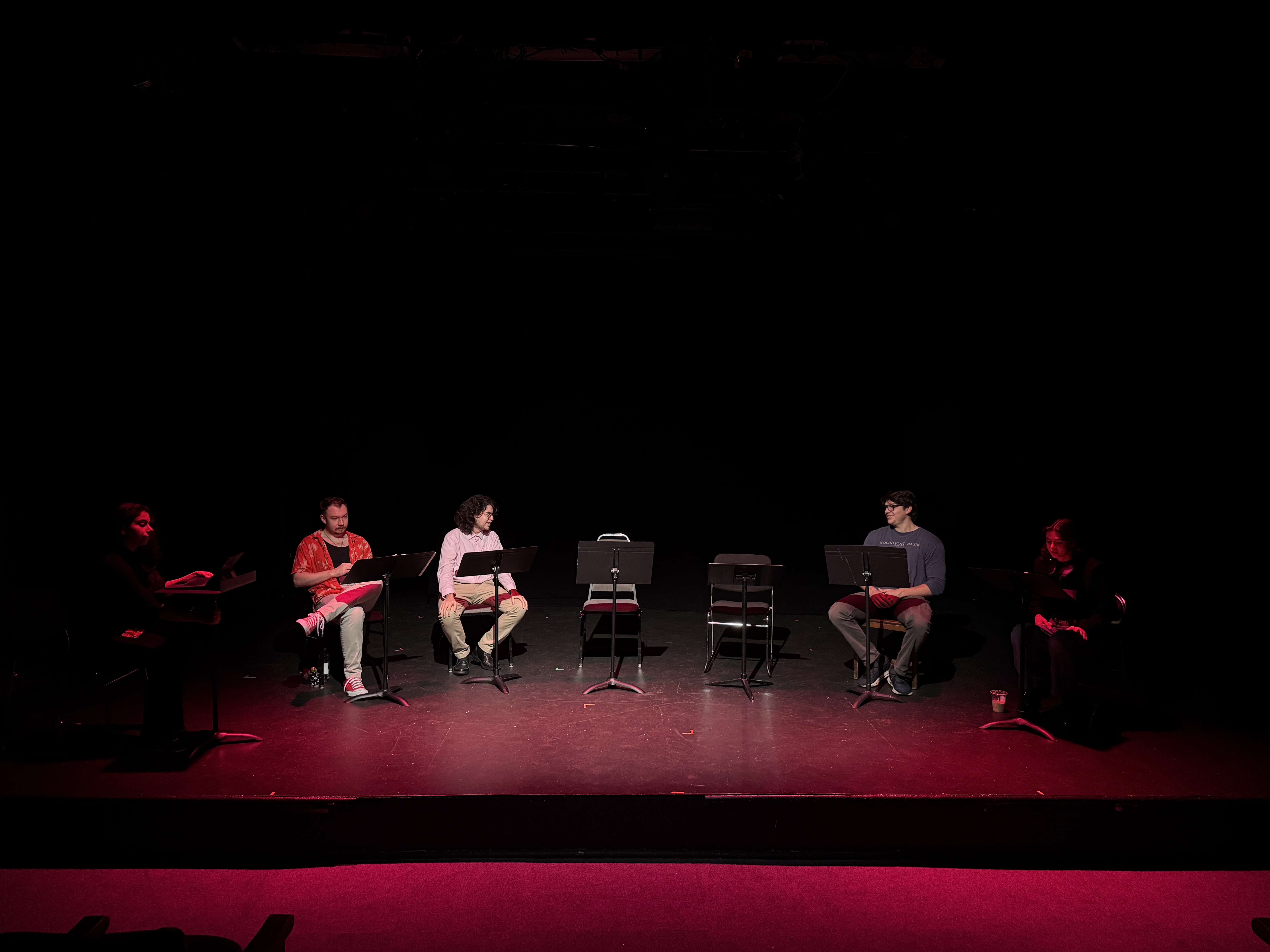 Two actors mid-dialogue in rehearsal blocking