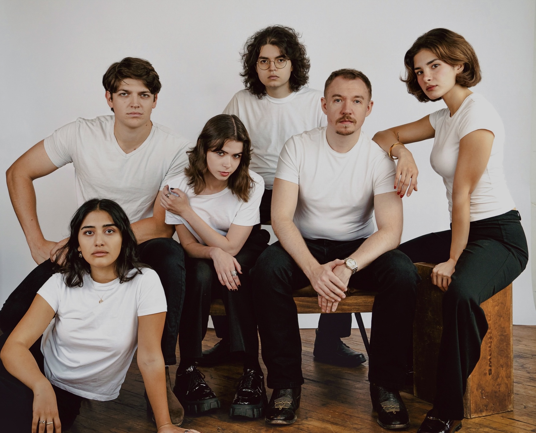Performer framed in crimson light on stage